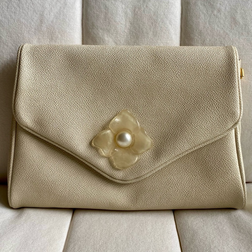 COCCINELLE Vintage Cream Envelope Clutch with Pearl Floral Accent